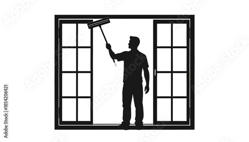 Silhouette of a man cleaning a window with a squeegee.