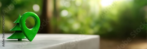 Eco-friendly location pin with tree symbol on white surface in nature setting