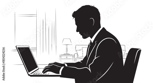 Professional man in silhouette diligently working on a laptop in a modern office environment