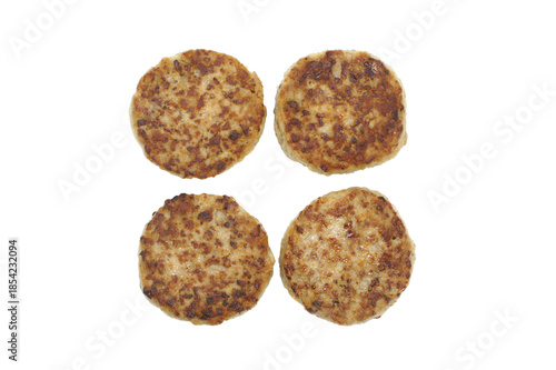 Fried meat cutlets isolated on white background. Set of four fresh cutlets. Top view.