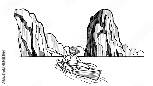 Kayaker navigating through majestic rock formations in black and white harmony