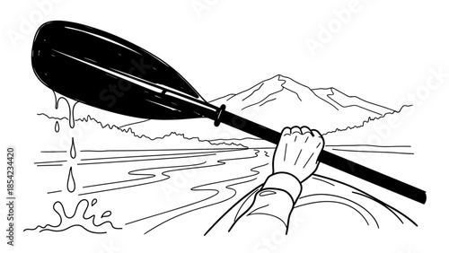 Hand holding a paddle in a canoe on a serene lake with mountain view