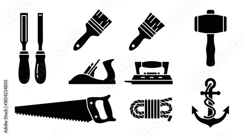 Silhouette set of hand tools and marine anchor icons for diy and nautical themes