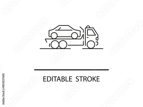 Tow truck transporting a car on a flatbed.