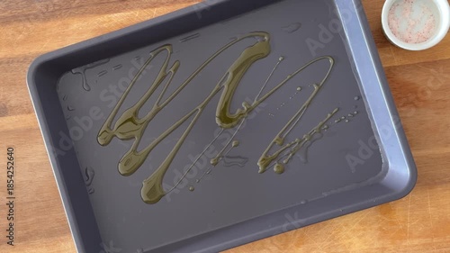 Adding Olive Oil to a Baking Sheet