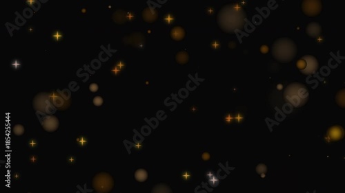 Golden bokeh lights and blurry stars animation on black background. Festive abstract celebration glow. Abstract background with particles