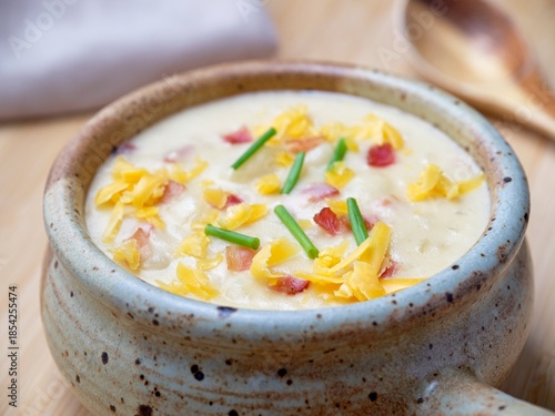 Homemade soup topped with cheese.