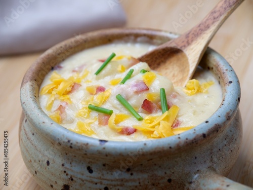 Spoon scooping out some soup.