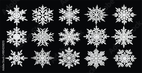Delicate white snowflakes on black background for winter designs