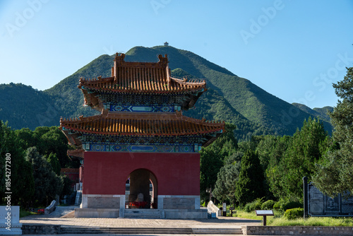 Obraz na płótnie The Stele Pavilion at the Ming Tombs Sacred Way with a green mountain peak in the background