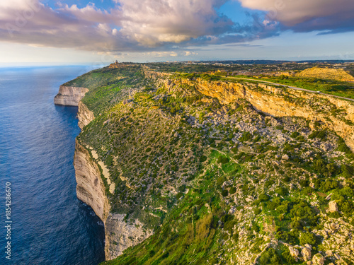 Drone view of cliffs and sea. Sunset, countryside, rocks, hills. Dingli cliffs. Mediterranean sea, Malta