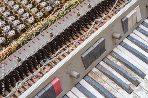 Vintage Piano with Exposed Wiring and Keys