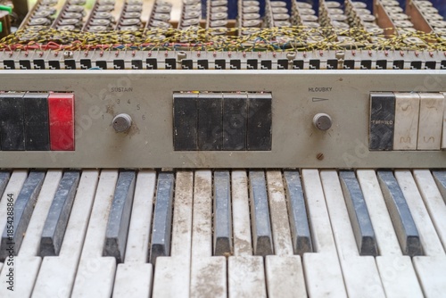 Vintage Piano Keyboard with Exposed Wires