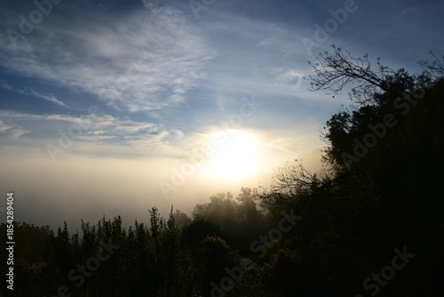 Stunning sunrise from a mountain top over the clouds