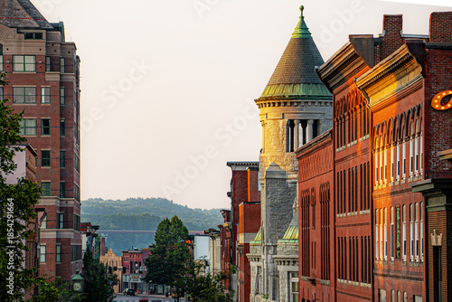Looking down Water Street in Augusta, Maine with hills and forests in the distance