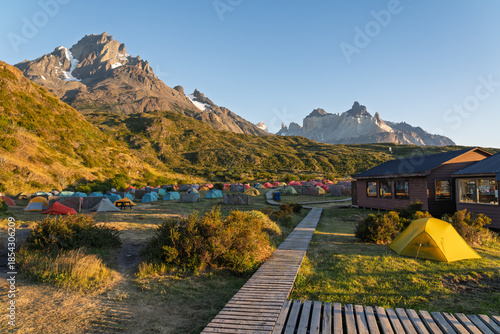 Busy Camping Paine Grande Site with Massive Peaks of Paine Massif at Sunrise