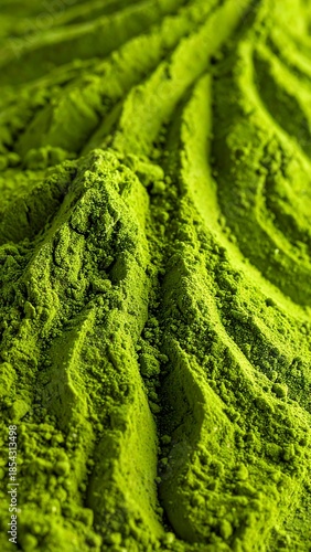 Wallpaper Mural Close-up view of vibrant green powder with textured, wavy ridges, showcasing its fine granular detail and rich color. Torontodigital.ca