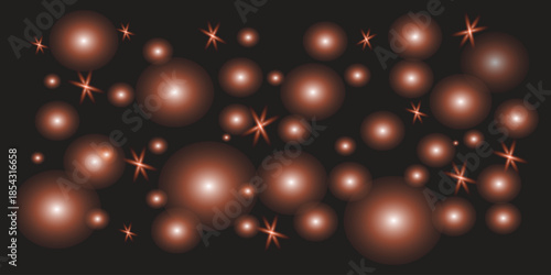 Blurry orange lights on a dark background resembling stars or glowing particles