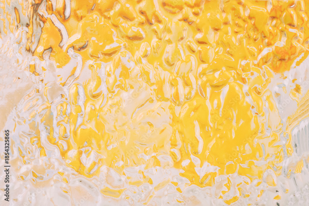 Obraz premium Abstract glass yellow and white paint pouring texture background