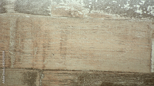 Three old light-colored wooden boards, tightly fitted together in a solid mass.