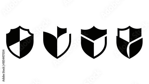 Set of four black and white shield icons representing security and protection