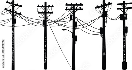 Silhouette of tall electric power poles with complex hanging wires, transformers, street light, urban electricity system, and voltage transmission network