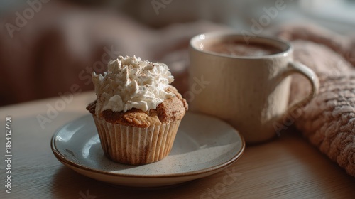 Cupcake and coffee in cozy setting