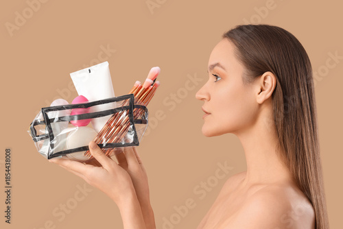 Beautiful young woman with ...