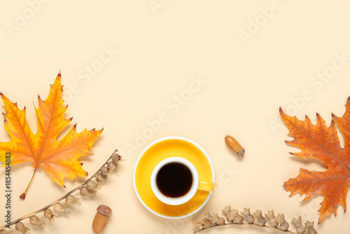 Foto Cup of coffee with acorns, autumn leaves and dried henbane seed pods on beige ba