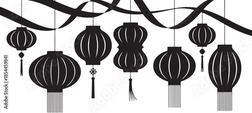 Black Chinese lanterns with tassels hanging from wavy ribbons