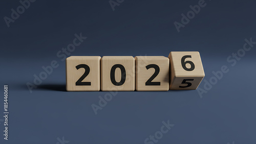 Wooden Cubes Flipping from 2025 to 2026 on Blue Background