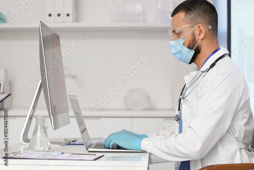 Male doctor analyzing scien...