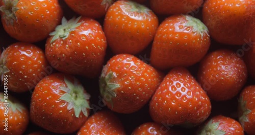 Strawberry close up studio shot over rotating