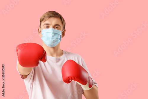 Young man in medical mask a...