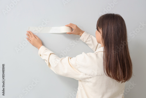 Young woman with adhesive t...