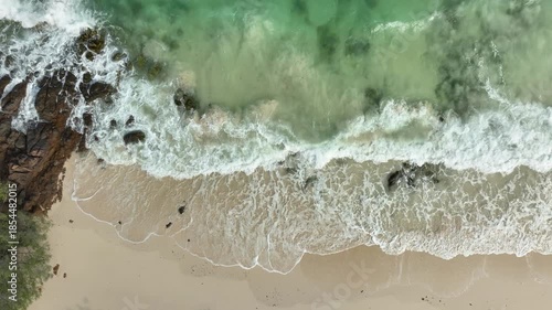 Nature of the ocean and blue sky Summer with sunshine, sandy beaches, clear blue waters sparkling against the blue sky. on an island with good ecology and environment Background for summer vacation	
