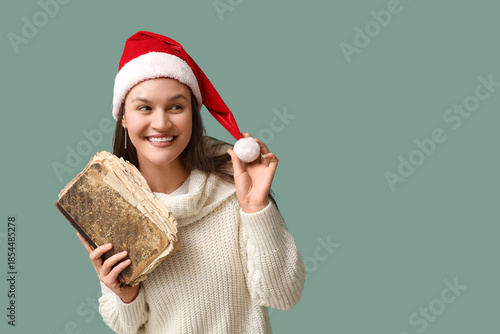 Happy young woman in Santa ...
