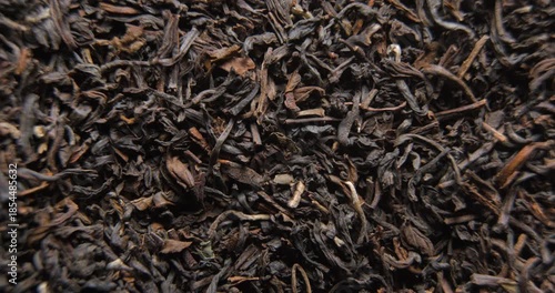 Tea dried leafs close up studio shot over rotating