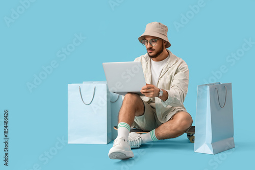 Stylish young man with shop...