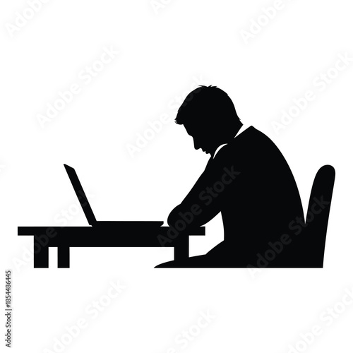 Silhouette of a focused businessman intensely working on a portable computer while seated at a desk on white background