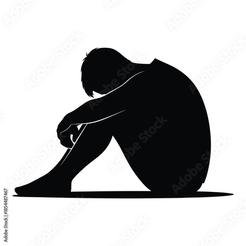Silhouette of a person huddled in a fetal position illustrating deep sadness despair and emotional distress on white background