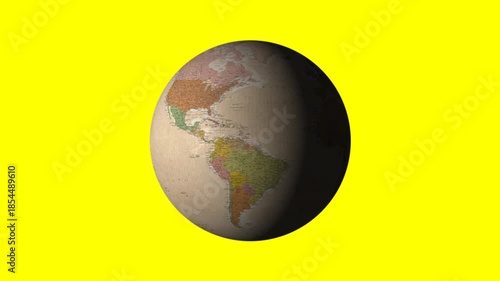 Rotating vintage globe showing continents and ocean patterns on a yellow background