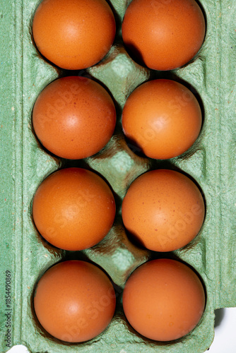 packaging with fresh chicken eggs, vertical top view
