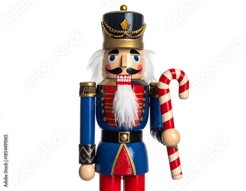 Classic wooden nutcracker soldier in a blue uniform holding a candy cane