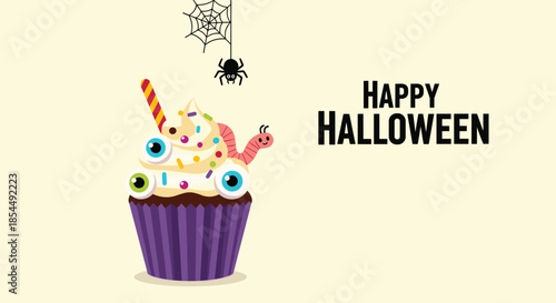 A spooky and fun Happy Halloween cupcake decorated with googly eyes, a gummy worm, and sprinkles, with a spider web in the corner.