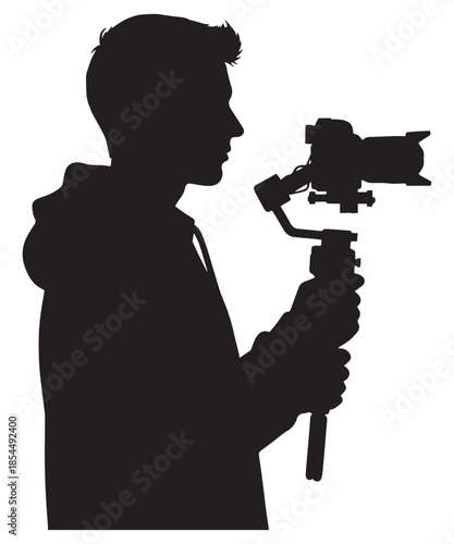Silhouette profile of a filmmaker or videographer holding a professional camera with a gimbal