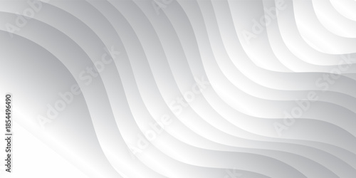 Smooth flowing white waves create an abstract design on a grey background.