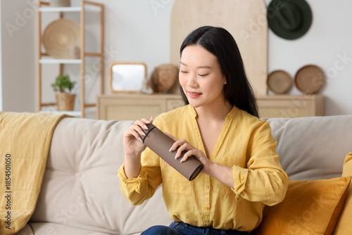 Young Asian woman with ther...