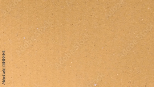 Cardboard grain texture background, vintage style yellow brown thick paper pattern.  Can be used as a pattern or background.

