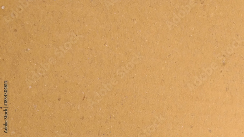 Cardboard grain texture background, vintage style yellow brown thick paper pattern.  Can be used as a pattern or background.
